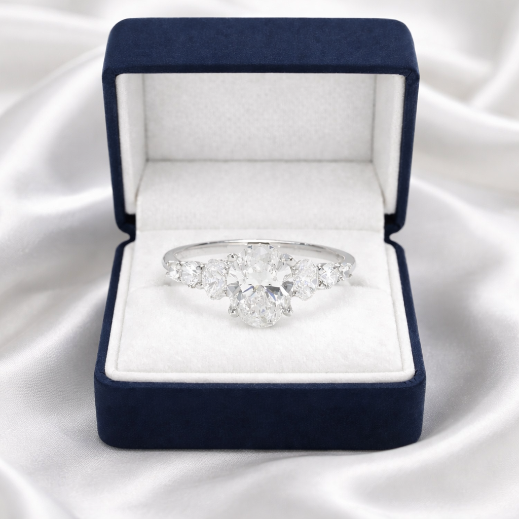 Elegantly Graduated Oval Diamond Engagement Ring