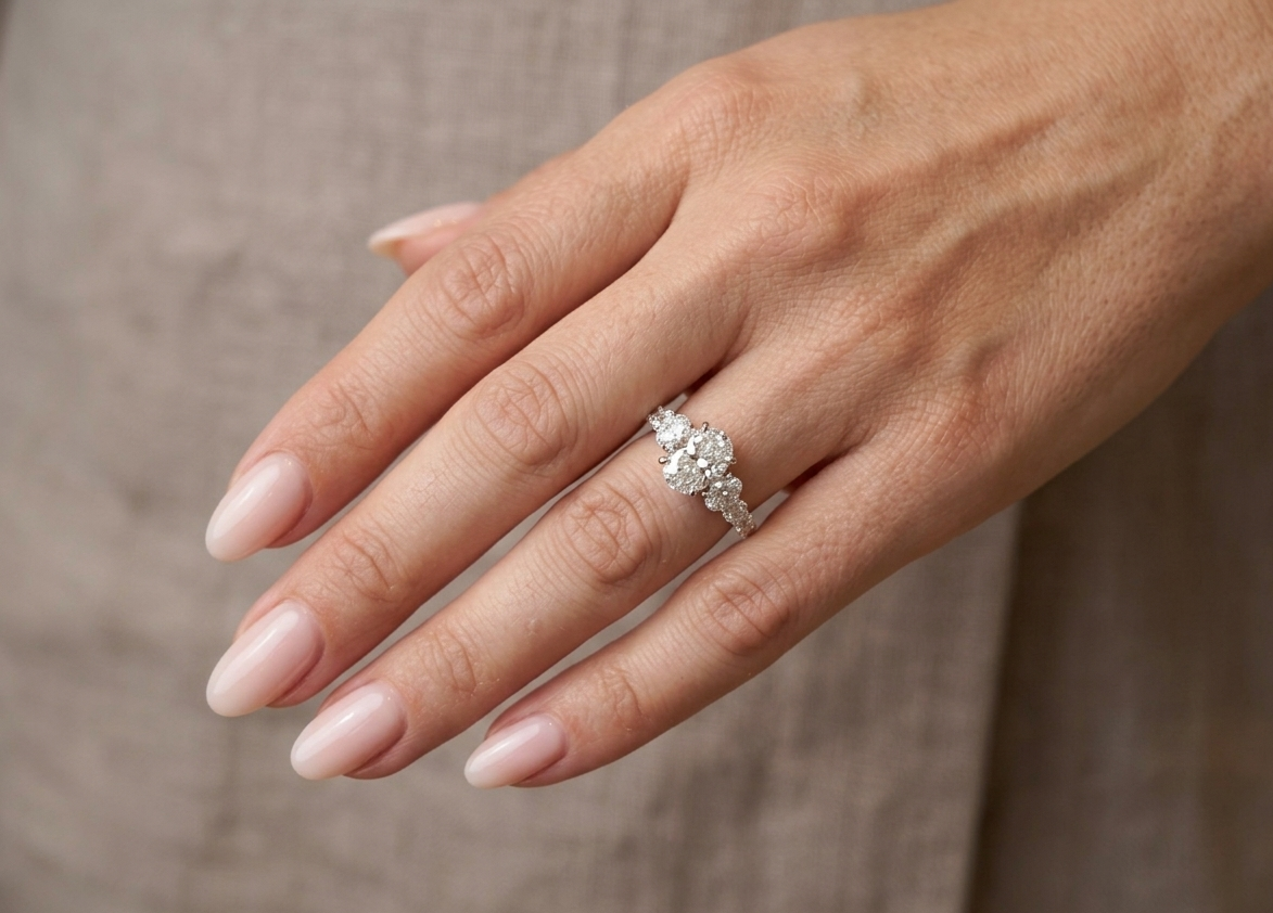 Elegantly Graduated Oval Diamond Engagement Ring