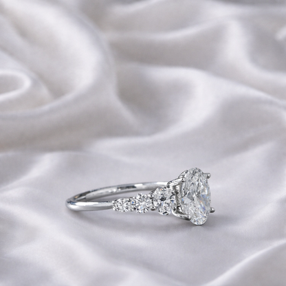 Elegantly Graduated Oval Diamond Engagement Ring