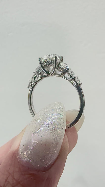 Elegantly Graduated Oval Diamond Engagement Ring